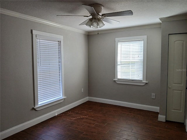 spare room featuring ornamental molding, ceiling fan, and dark hardwood / wood-style flooring