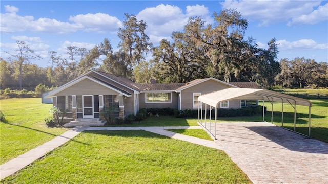 ranch-style home with a front yard and a carport