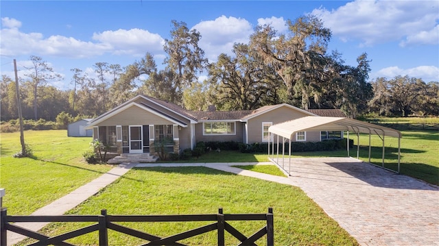 single story home with a front lawn and a carport