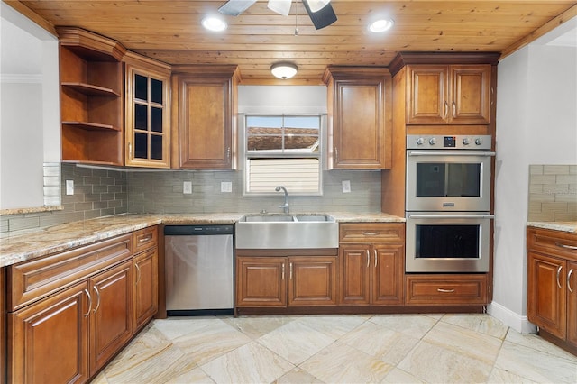 kitchen featuring ornamental molding, sink, stainless steel appliances, and tasteful backsplash