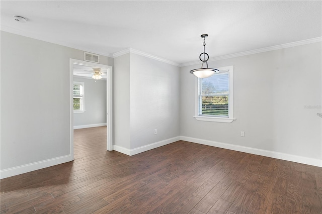 unfurnished room featuring ornamental molding, dark wood-type flooring, a healthy amount of sunlight, and ceiling fan