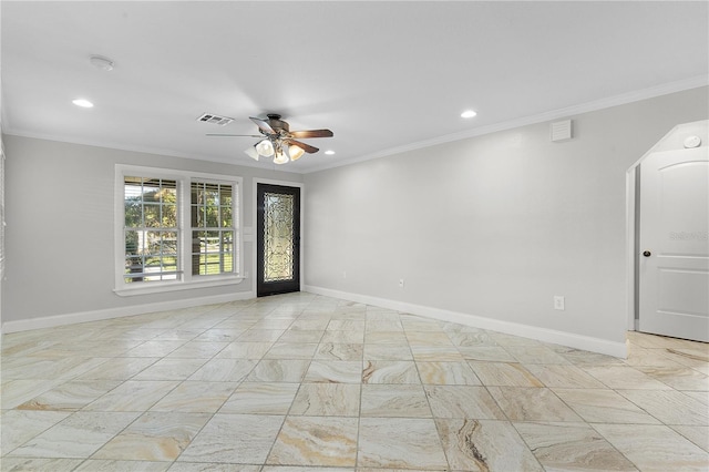 spare room featuring crown molding and ceiling fan