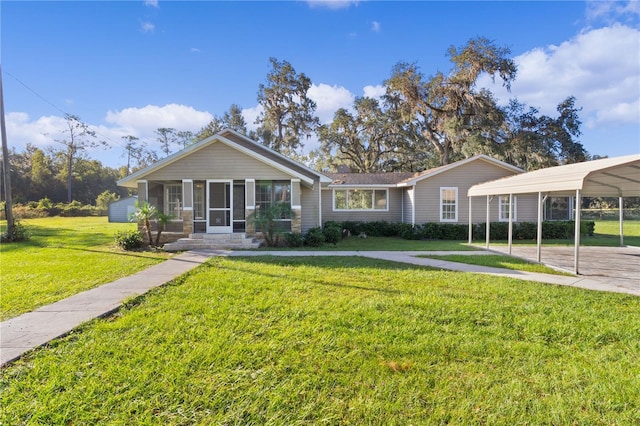 single story home featuring a carport and a front lawn