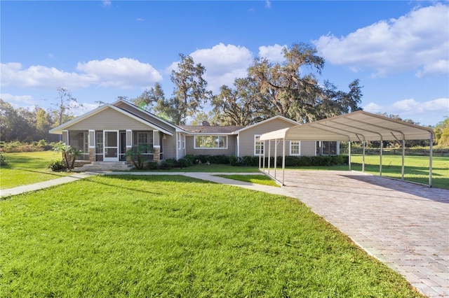 ranch-style home with a front lawn and a carport