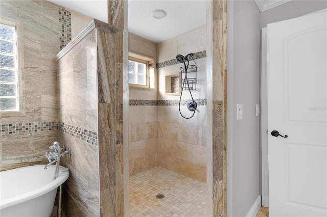 bathroom featuring independent shower and bath and plenty of natural light