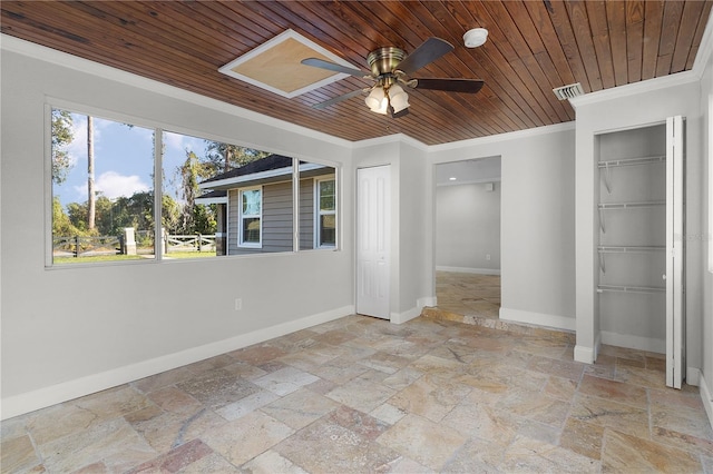 unfurnished bedroom with wood ceiling, two closets, crown molding, and ceiling fan