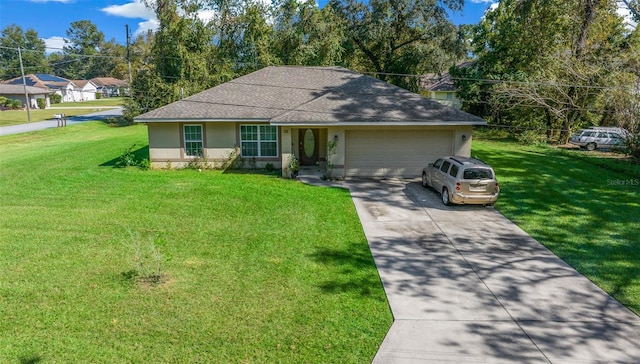 ranch-style home featuring a front lawn and a garage