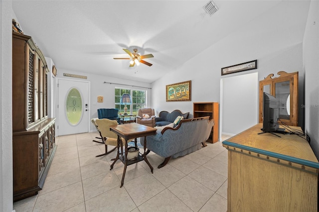 tiled living room with ceiling fan and lofted ceiling