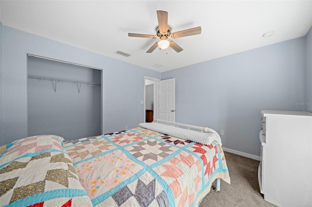 carpeted bedroom featuring a closet and ceiling fan