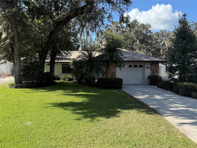 ranch-style home with a front lawn and a garage