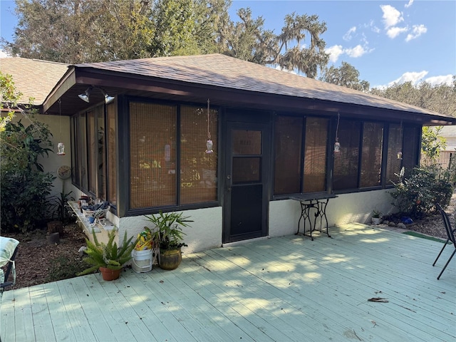 deck with a sunroom