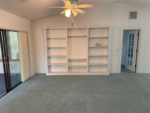 interior space featuring ceiling fan, carpet flooring, and vaulted ceiling