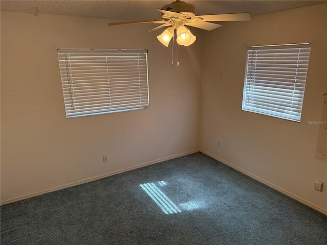 carpeted empty room featuring a textured ceiling and ceiling fan