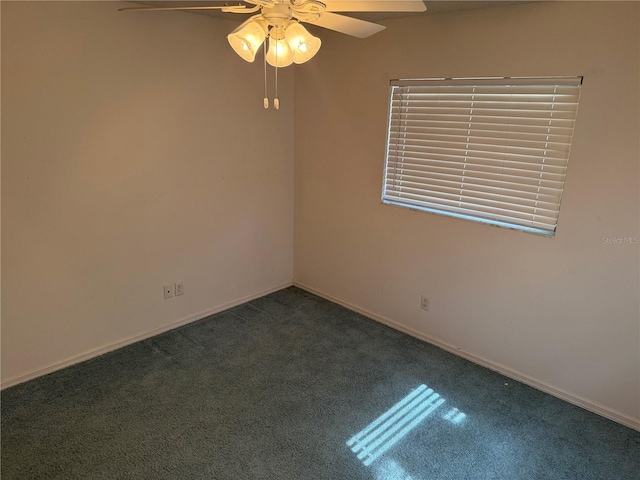 spare room with carpet floors and ceiling fan