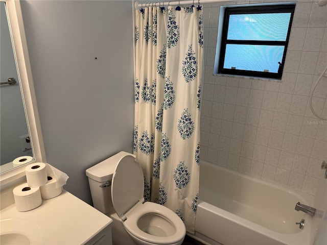 full bathroom featuring vanity, toilet, and shower / bathtub combination with curtain