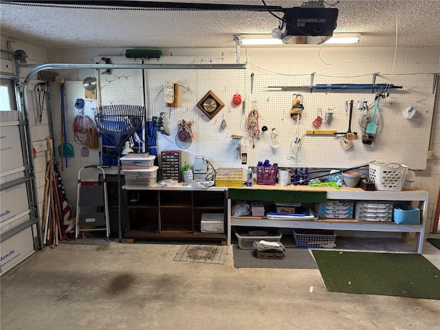 garage featuring a garage door opener and a workshop area