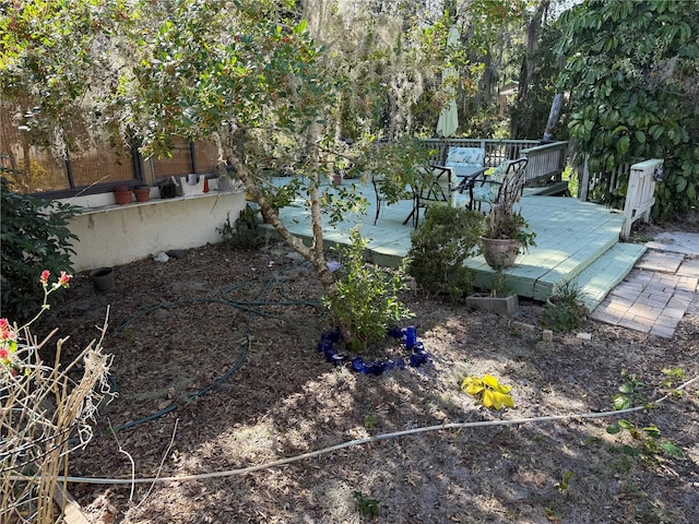 view of yard featuring a wooden deck