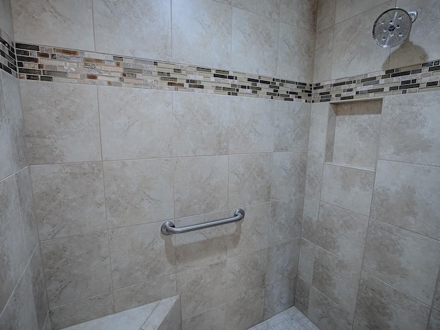 bathroom with tiled shower