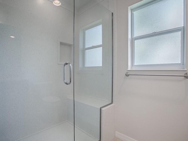 bathroom featuring an enclosed shower