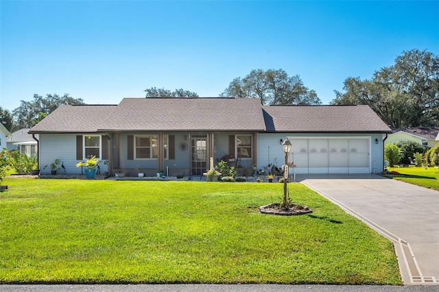 single story home featuring a front lawn and a garage