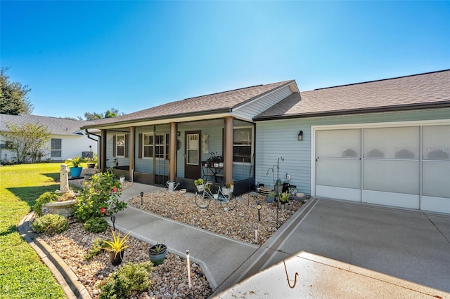 ranch-style house with a front yard and a garage