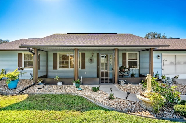 ranch-style home with a front lawn and a garage