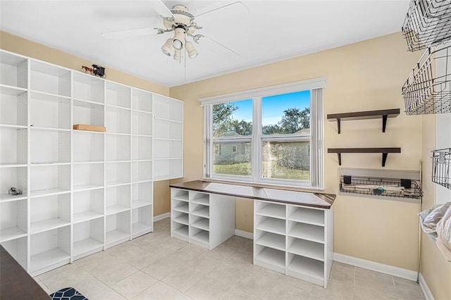 spacious closet featuring ceiling fan and light tile patterned floors