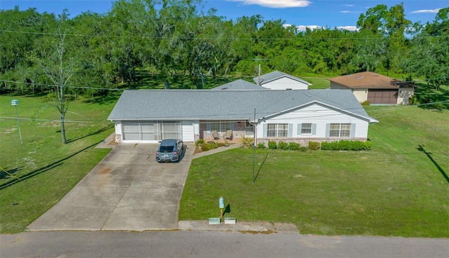 ranch-style house with a garage and a front lawn