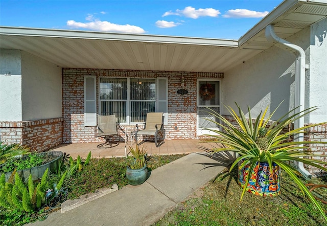 entrance to property with a patio area