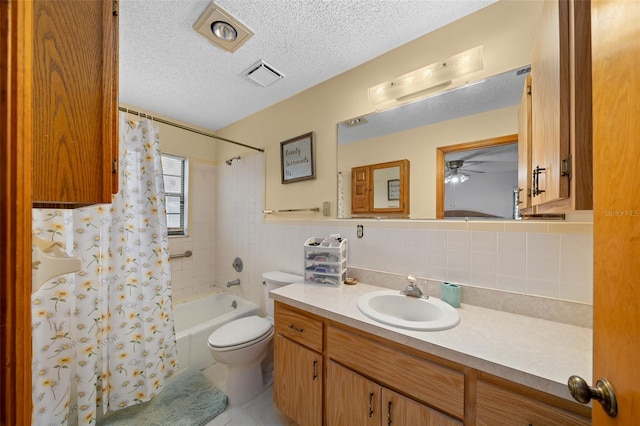 full bathroom with decorative backsplash, toilet, tile patterned flooring, shower / bath combo with shower curtain, and vanity