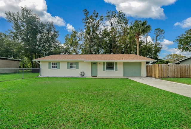 single story home featuring a front yard and a garage