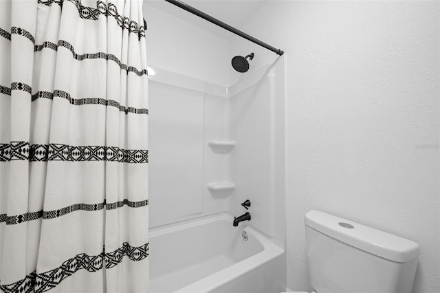 bathroom with toilet and shower / tub combo