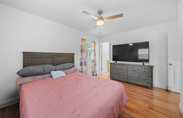 bedroom with ceiling fan and light hardwood / wood-style flooring