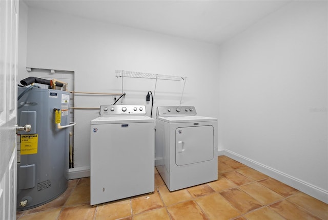 laundry room featuring washer and dryer, electric water heater, and light tile patterned floors