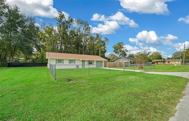 ranch-style house featuring a front lawn