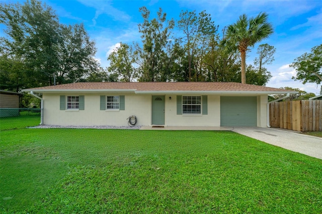 single story home with a garage and a front lawn