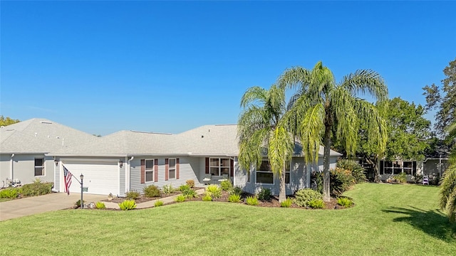 ranch-style home featuring a front lawn and a garage