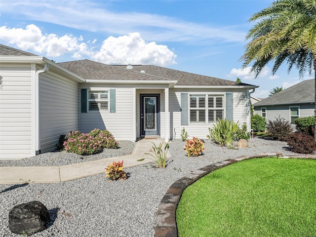 ranch-style house with a front yard