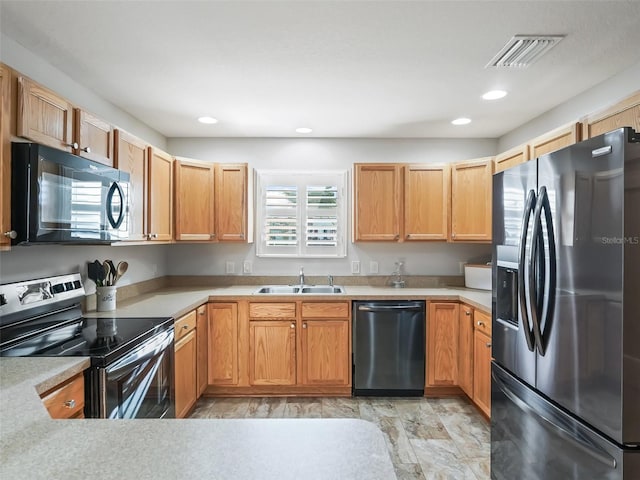 kitchen featuring a sink, stainless steel appliances, recessed lighting, and visible vents
