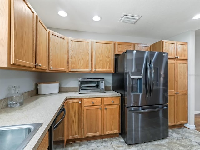 kitchen with visible vents, a toaster, recessed lighting, light countertops, and black appliances