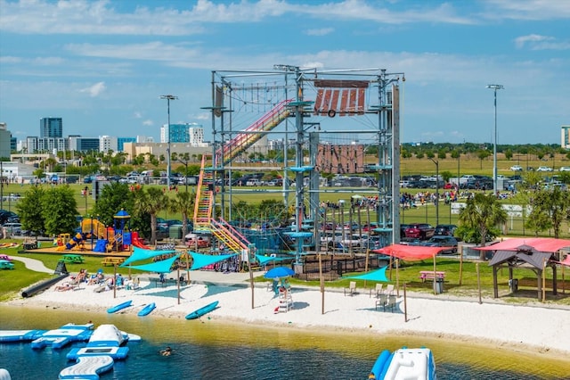 view of playground with a water view