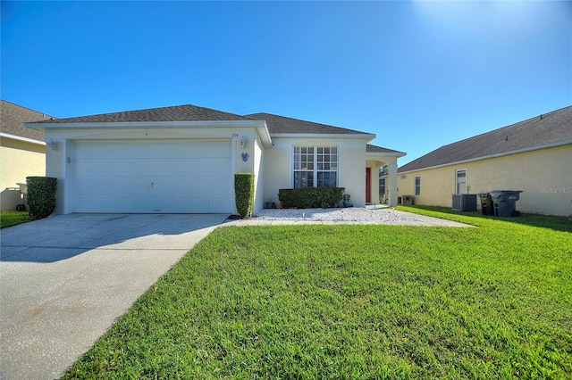 view of front of house with a garage and a front lawn