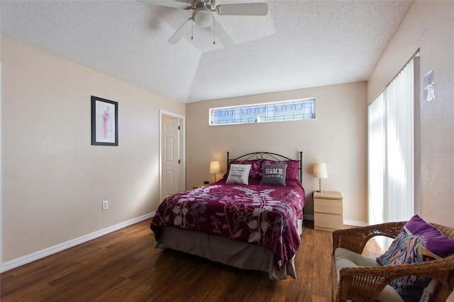 bedroom with hardwood / wood-style floors, vaulted ceiling, a textured ceiling, and ceiling fan