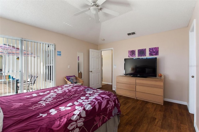 bedroom with access to outside, a textured ceiling, dark wood-type flooring, and ceiling fan