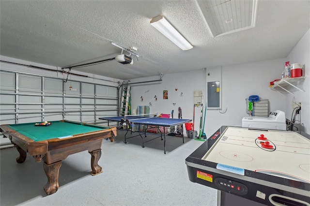 game room featuring electric panel, a textured ceiling, billiards, and washer / clothes dryer