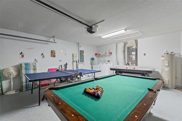 rec room with pool table, independent washer and dryer, a textured ceiling, electric water heater, and electric panel