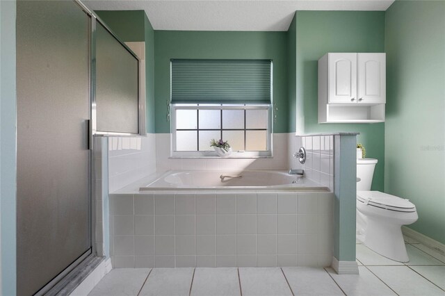 bathroom with toilet, plus walk in shower, and tile patterned floors