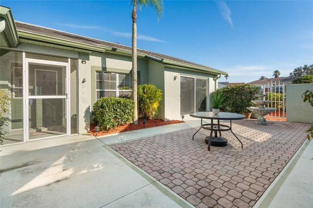 back of property featuring a patio