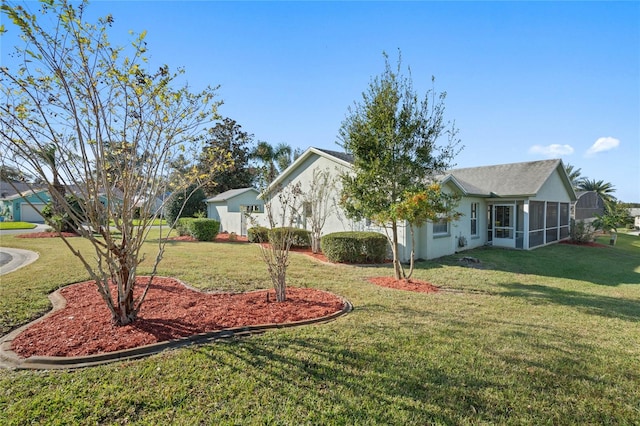 view of yard with a sunroom