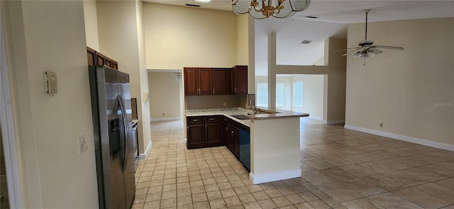 kitchen with dishwasher, sink, high vaulted ceiling, kitchen peninsula, and stainless steel fridge